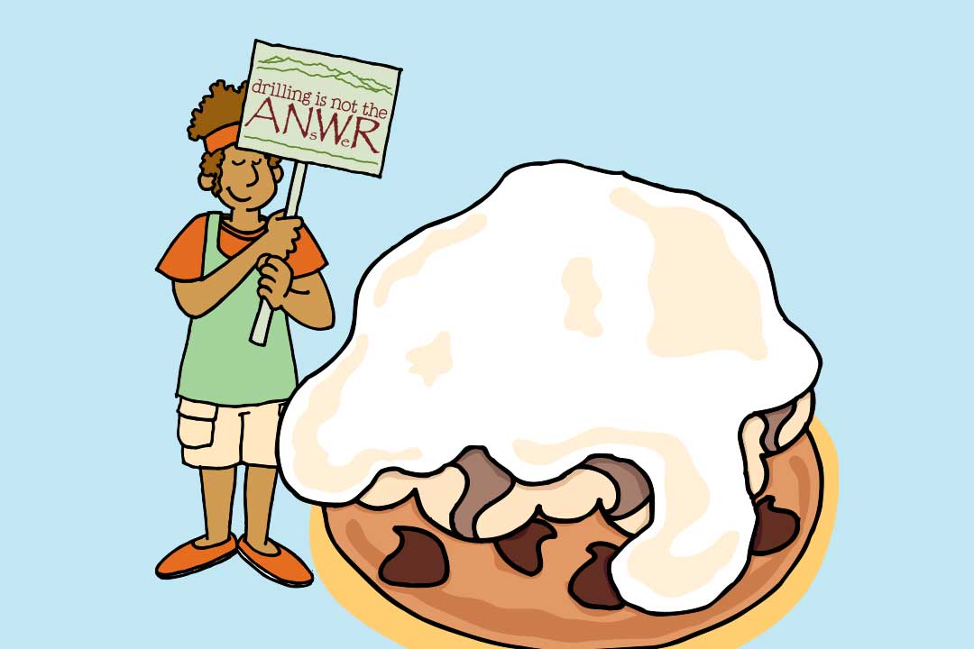 Uma senhora segura um cartaz “Perfurar não é a solução” ao lado de um pedaço de Baked Alaska 